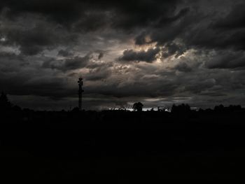 Silhouette of landscape against dramatic sky
