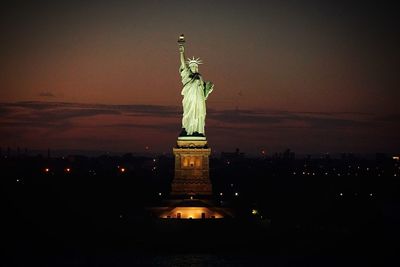 Statue of liberty against sky at dusk