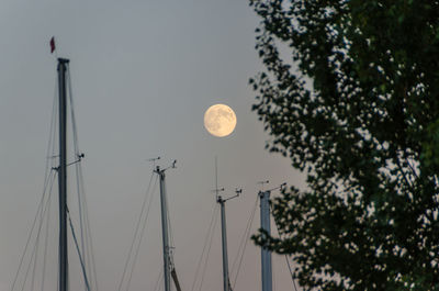 Low angle view of moon against clear sky