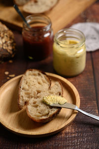 Close-up of bread and butter on table