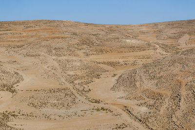 Scenic view of desert against clear sky