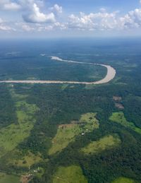 High angle view of landscape and sea against sky