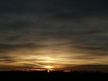 Scenic view of dramatic sky during sunset