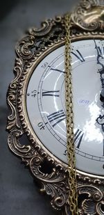 High angle view of clock on glass table