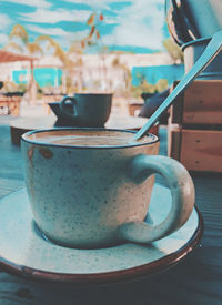 Close-up of coffee cup on table