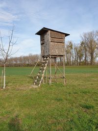 Built structure on field against sky