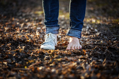 Low section of man standing on ground