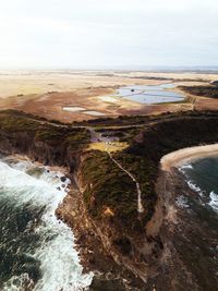 Aerial view of mountain by sea