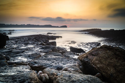 Scenic view of sea against sky during sunset