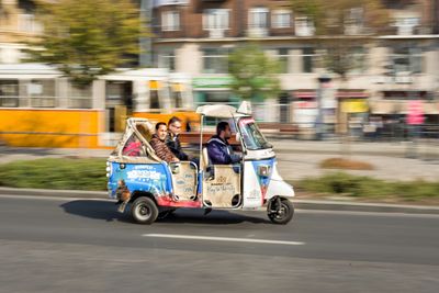 Blurred motion of man sitting on road