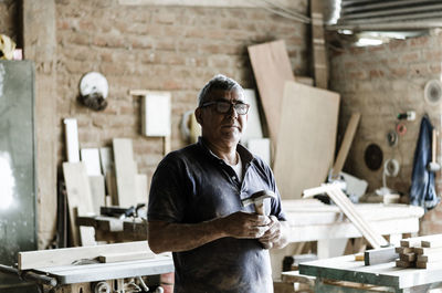 Portrait of man working on table