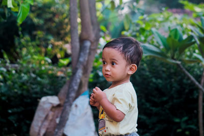 Cute boy looking away outdoors