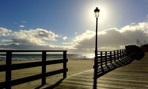 Pier over sea against sky