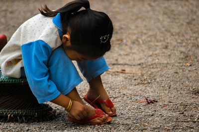 Full length of girl playing on road