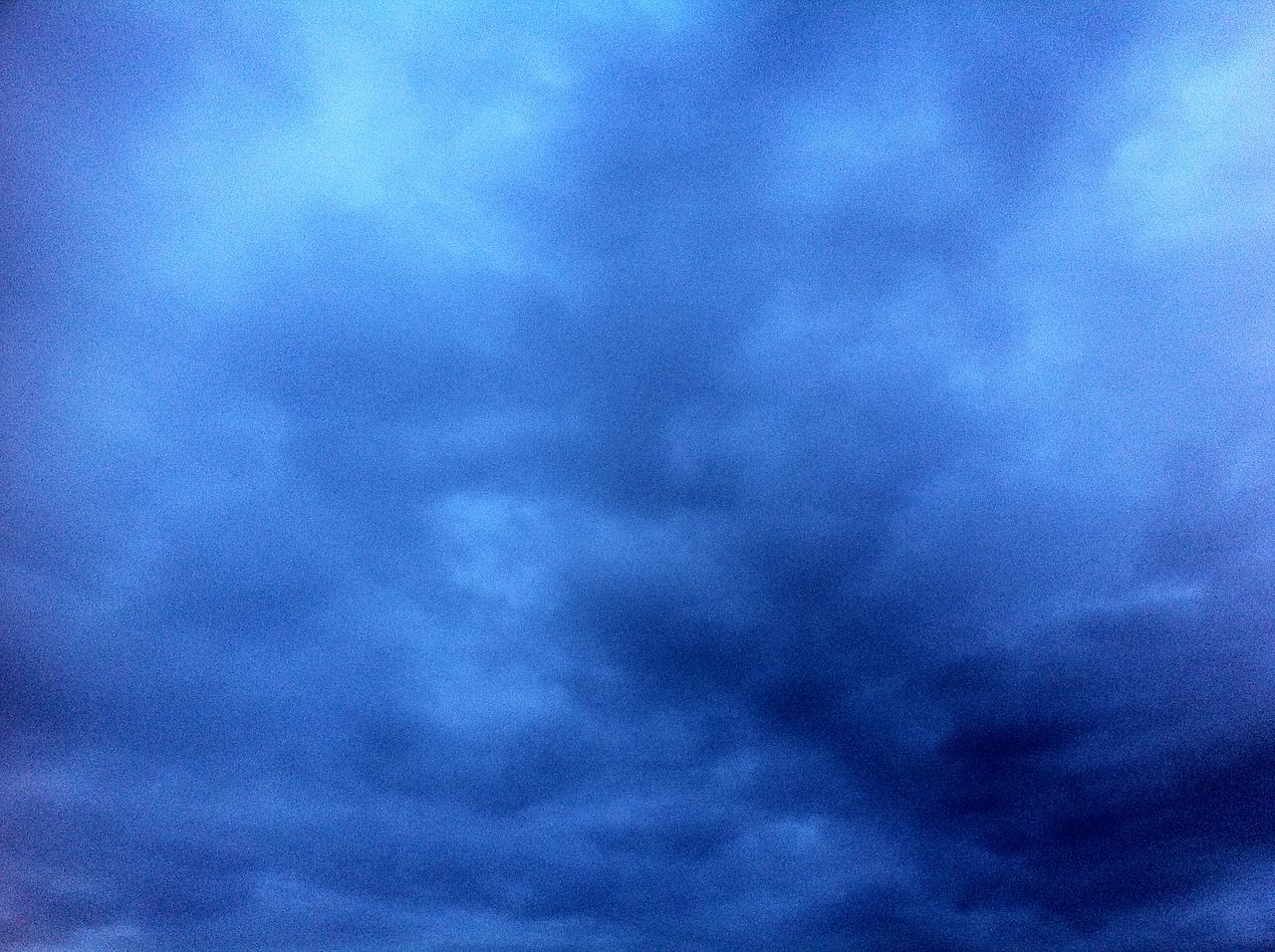 sky, low angle view, cloud - sky, cloudy, sky only, beauty in nature, cloudscape, scenics, tranquility, blue, nature, backgrounds, weather, tranquil scene, full frame, cloud, overcast, idyllic, dramatic sky, storm cloud