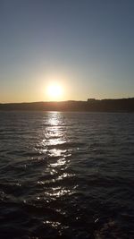 Scenic view of sea against clear sky during sunset
