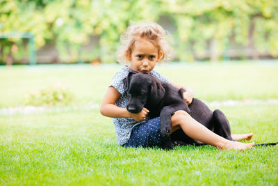 Portrait of boy on grassy field