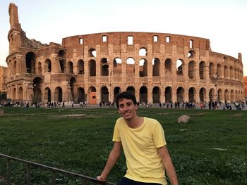 Portrait of man against historic building against clear sky