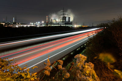 High angle view of light trails on road at night