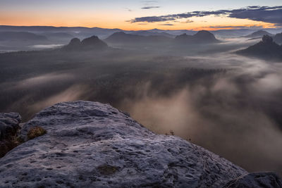 Scenic view of mountains against sky during sunset