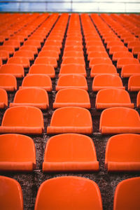 Empty orange seats at stadium