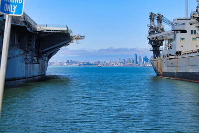 View of city by sea against sky