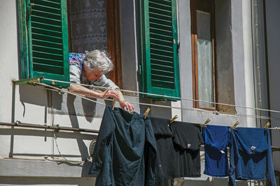 Woman standing against window