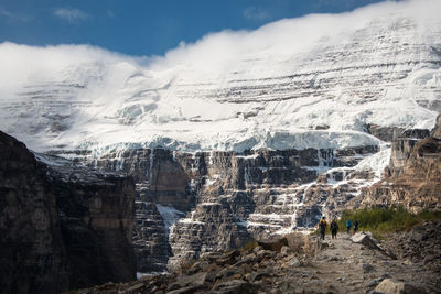 Aerial view of snowcapped mountains against sky