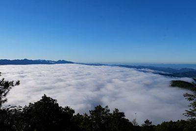 Scenic view of mountains against clear blue sky