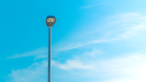 Low angle view of street light against sky