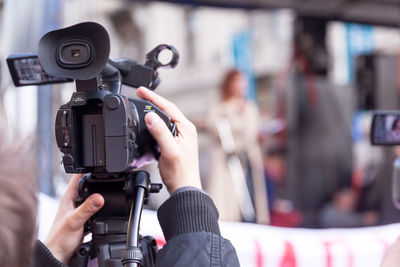 Close-up of man photographing