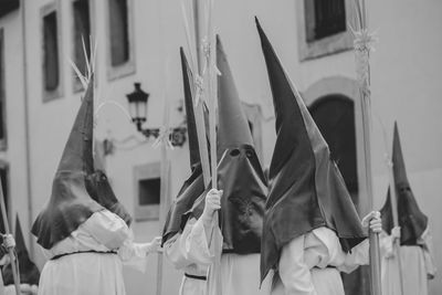 Hooded people in a procession, holy week