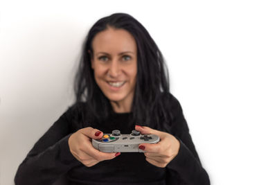 Portrait of a smiling young woman over white background