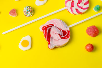 High angle view of multi colored candies on table