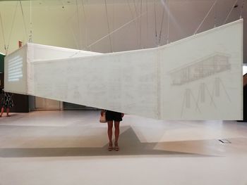 Woman standing in front of museum