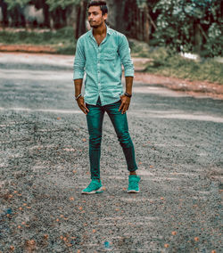 Full length of man standing on road