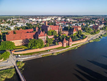 High angle view of river amidst buildings in city