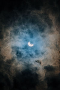 Full frame shot of moon in cloudy sky