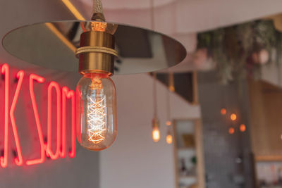 Low angle view of illuminated light bulb