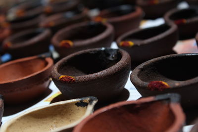Artistic homemade clay oil lamps or karthikai deepam are ready for diwali and karthikai festivals