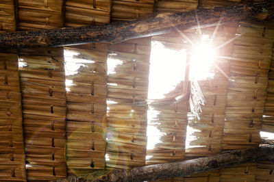 Low angle view of sunlight streaming through window