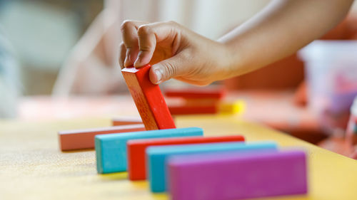 Boy playing with toy on table