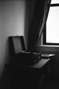 Close-up of window on table at home