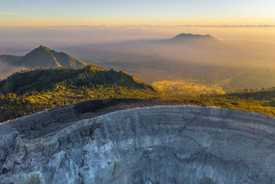 Scenic view of mountains against sky during sunset