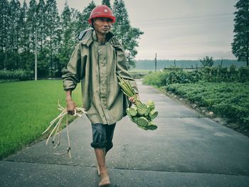 Senior man walking barefoot in asia
