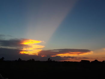 Scenic view of silhouette landscape against sky during sunset