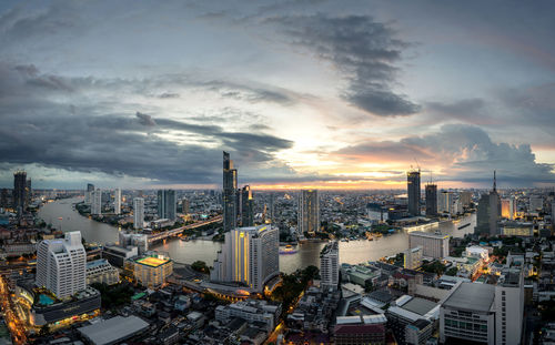High angle view of buildings against sky during sunset