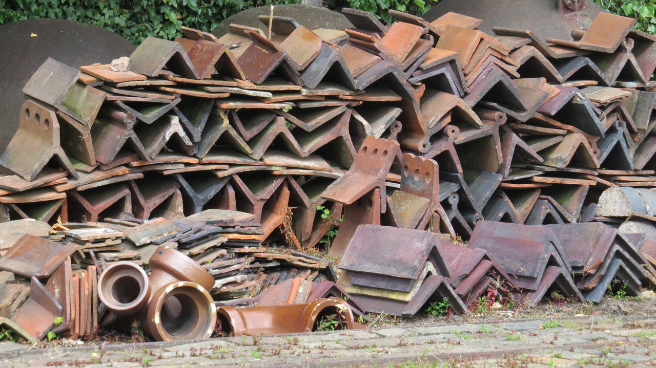 STACK OF ABANDONED RUSTY METAL AGAINST THE SKY