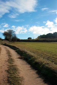 Empty road along countryside landscape
