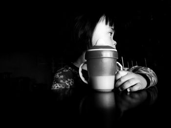 Portrait of woman drinking coffee